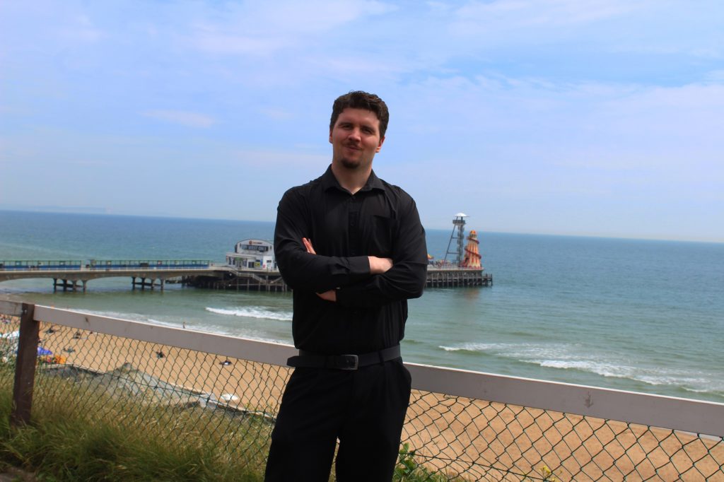 If you're having your author headshots done outside, make sure they take advantage of the backdrop available. Such as the Bournemouth landscape in this case.